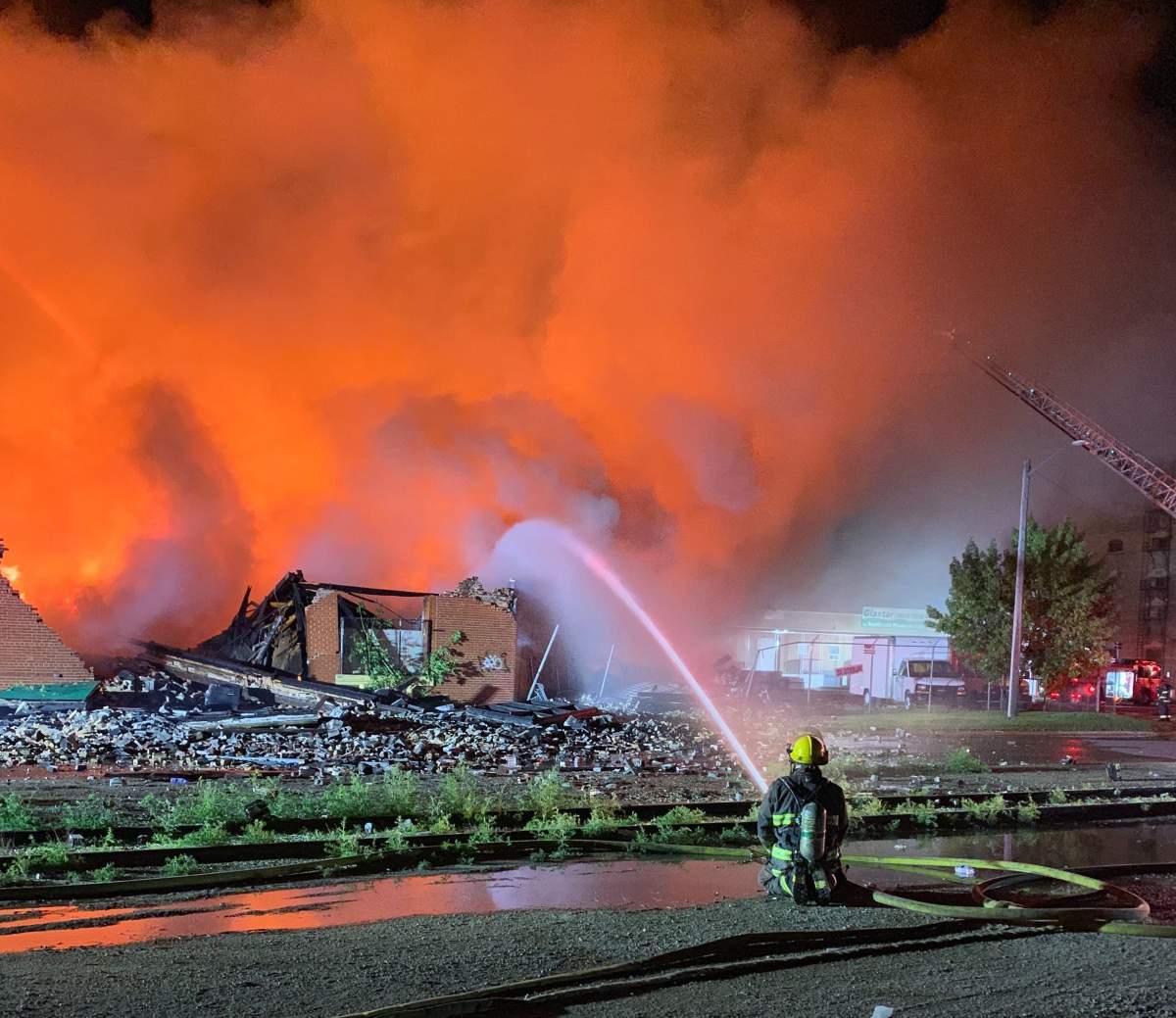 A firefighter battles the blaze on Jarvis Avenue Monday. 