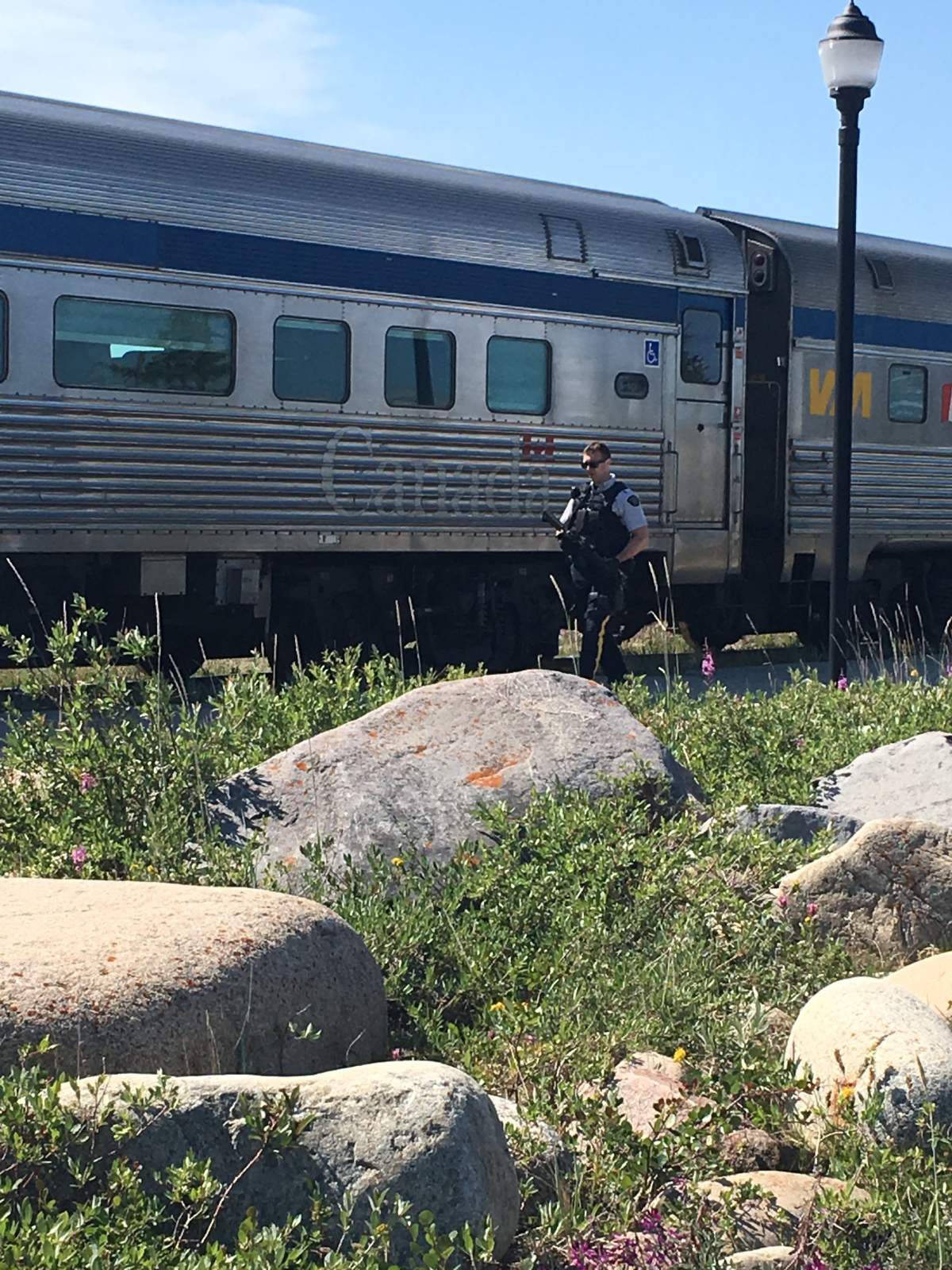 An increased presence of RCMP officers were on scene at the train station in Churchill, Man., after they say that two murder suspects were last seen nearby.