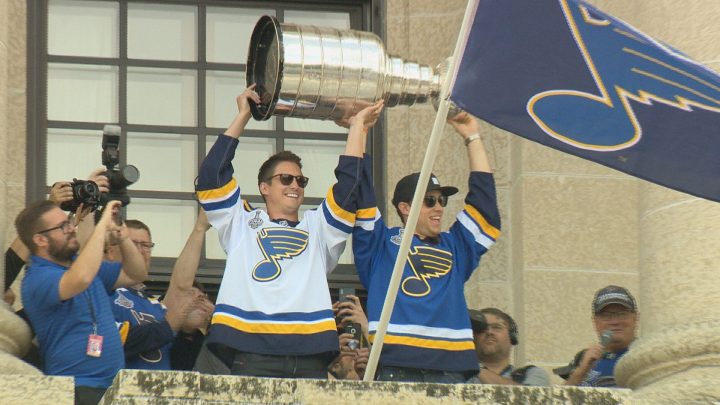 Tyler Bozak and Jaden Schwartz of the St. Louis Blues raise the Stanley Cup at the Saskatchewan Legislature on July 6, 2019.