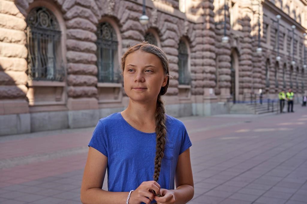 Greta Thunberg stands next to Swedish Parliament in Stockholm on July 26, 2019.