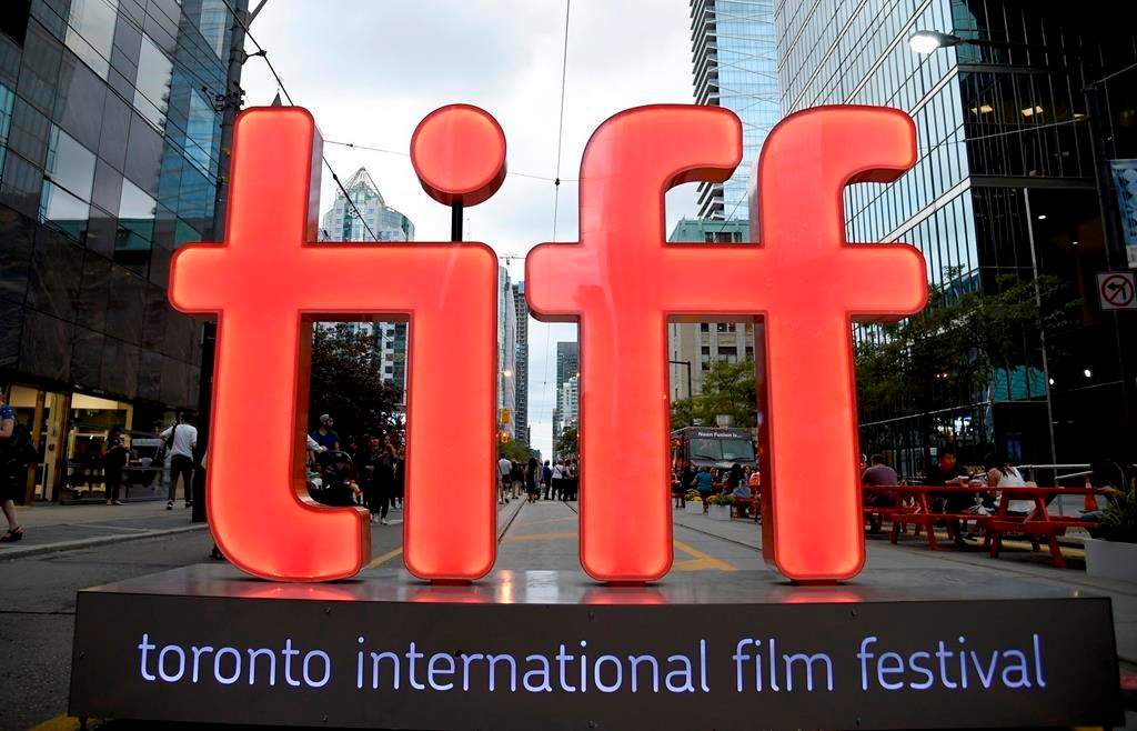 FILE - In this Thursday, Sept. 6, 2018, file photo, a view of a festival sign appears on Day 1 of the Toronto International Film Festival in Toronto. TIFF organizers announced Tuesday, July 23, 2019, that the upcoming festival will include the premieres of the superhero film “Joker,” a Mister Rogers biopic starring Tom Hanks and “Hustlers,” a film about strippers scamming Wall Street bankers, with Jennifer Lopez and Cardi B. (Photo by Chris Pizzello/Invision/AP, File).