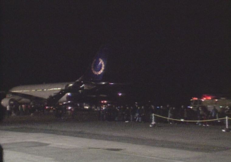 A plane of Kosovar refugees arrives at the Halifax airport in 1999.