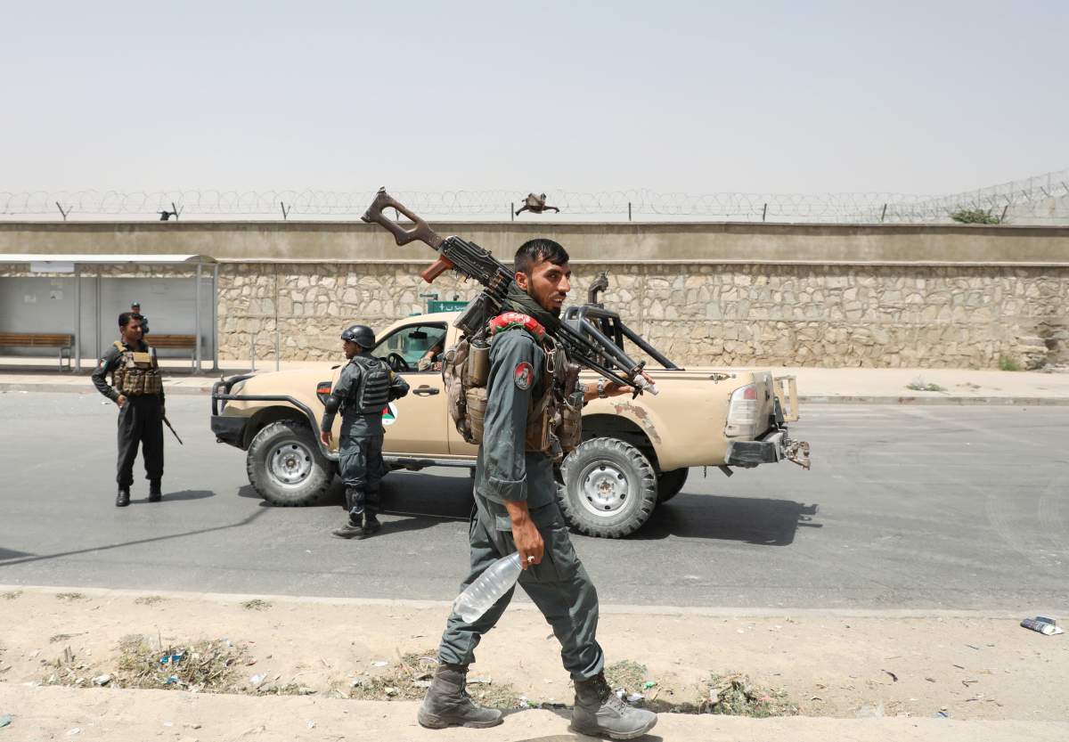 Members of Afghan security forces keep watch at the site of a car bomb blast in Kabul, Afghanistan, August 7, 2019. REUTERS/Omar Sobhani