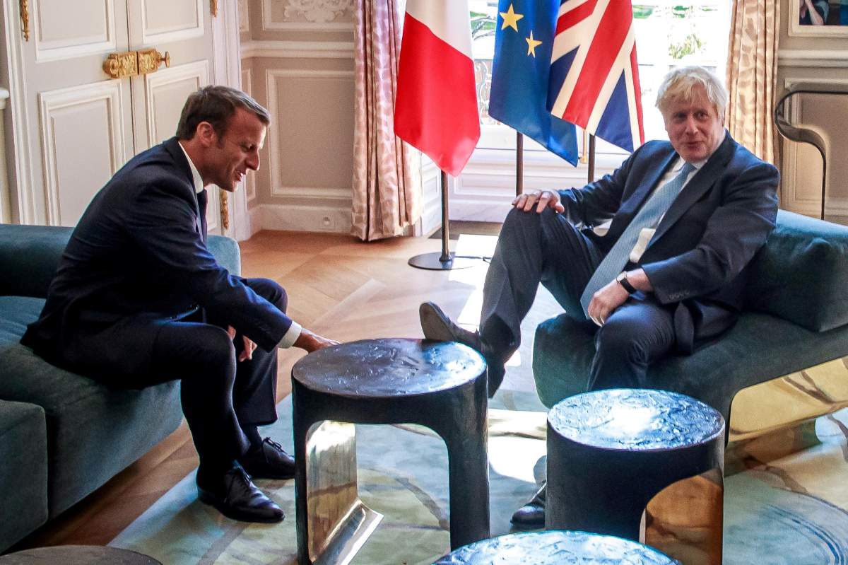 French President Emmanuel Macron and British Prime Minister Boris Johnson speak during a meeting at the Elysee Palace in Paris, France, August 22, 2019.
