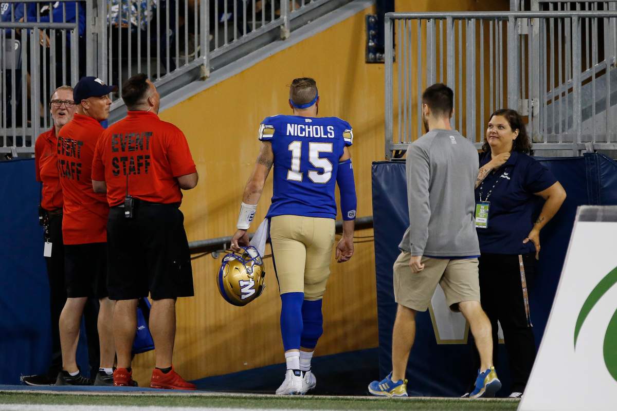 Winnipeg Blue Bombers quarterback Matt Nichols (15) leaves the field early against the BC Lions in the second half of CFL action in Winnipeg Thursday, August 15, 2019. 