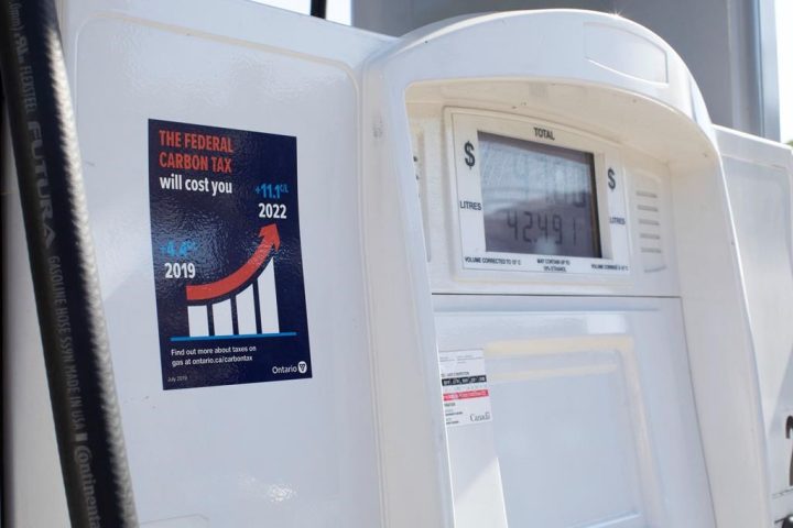 A gas pump displays an anti-carbon tax sticker in Toronto on Thursday, Aug. 29, 2019. A law required gas station owners across Ontario to post anti-carbon price stickers on their pumps. THE CANADIAN PRESS/Chris Young