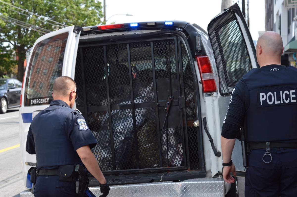 Halifax Regional Police close the doors of van full of cannabis and cannabis products they seized from Farm Assists on August 1, 2019.