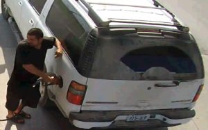 Photo of a gas-theft suspect driving vehicle with stolen licence plate