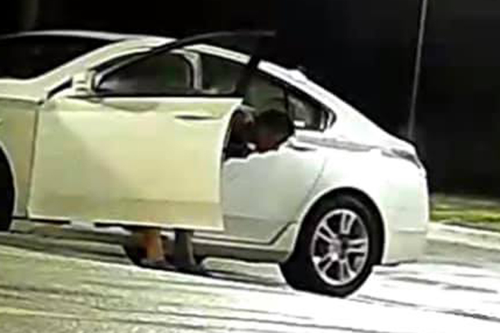 A man is shown vomiting in front of the Maven hair studio in Urbandale, Iowa, in this photo posted online Aug. 1, 2019.