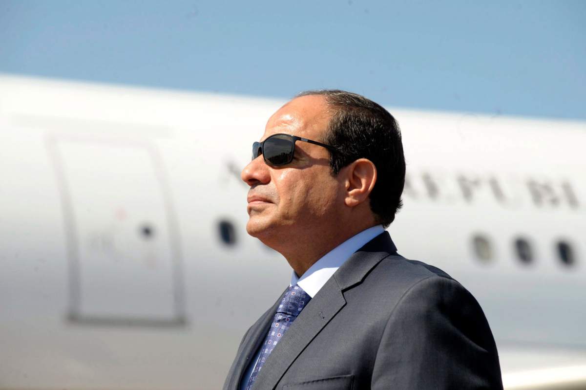 FILE - In this June 25, 2014, file photo, Egyptian President Abdel-Fattah el-Sissi stands at Algiers airport on his arrival to Algiers, Algeria.