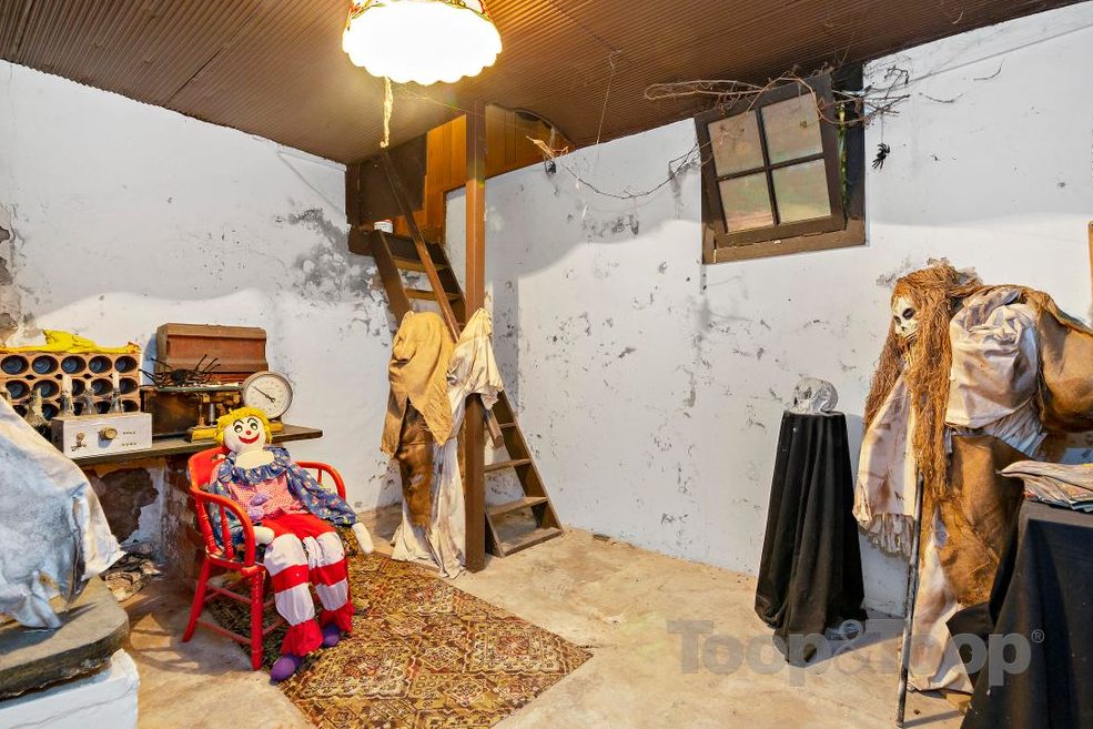 Several ghoulish figures are shown inside the Woodforde House in South Australia in this image from a real estate listing.
