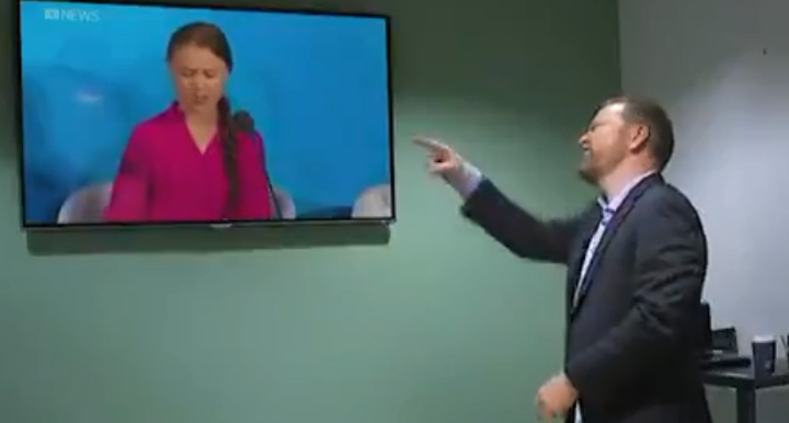 Comedian Mark Humphries points at Swedish activist Greta Thunberg in this still image from an ABC 730 video.