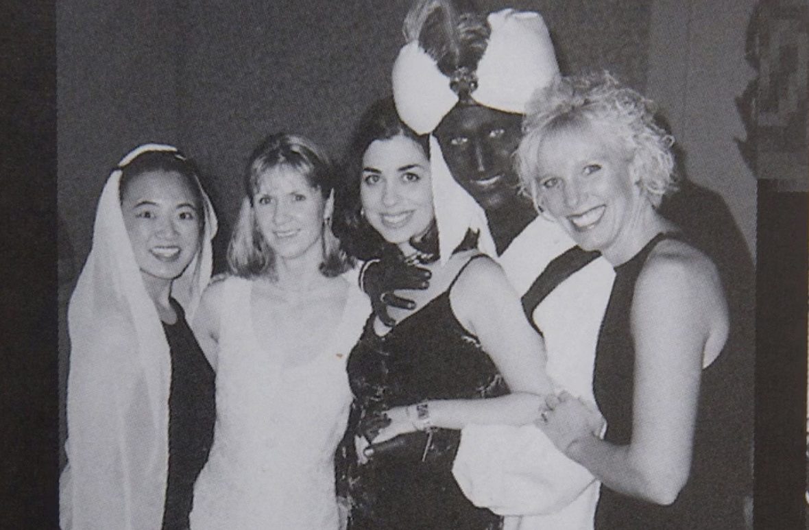 A photo showing Liberal Leader Justin Trudeau, second from right, at a 2001 costume party — his hands and face blackened with makeup — was published by Time Magazine Wednesday.