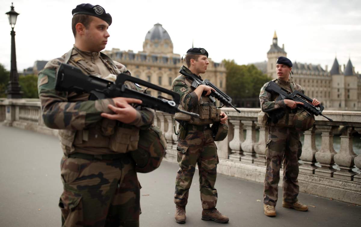 Security personnel is seen after an attack on the police headquarters in Paris, France, October 3, 2019. REUTERS/Christian Hartmann
