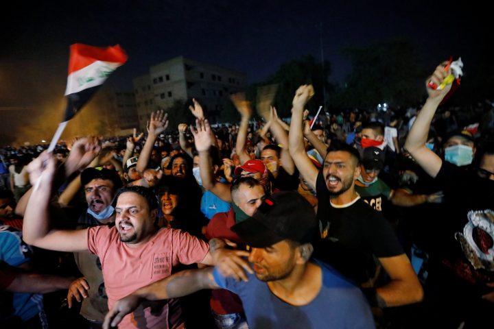 Demonstrators gather at a protest during a curfew, two days after the nationwide anti-government protests turned violent, in Baghdad, Iraq, Oct. 3, 2019.