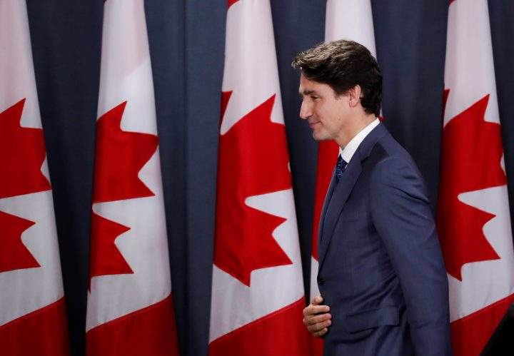 Prime Minister Justin Trudeau leaves the stage after speaking to the news media for the first time since winning a minority government in the federal election on Oct. 23, 2019.