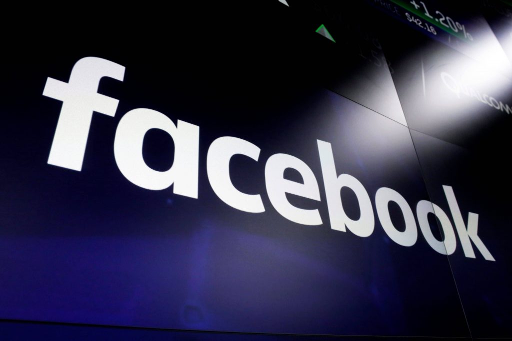 FILE - This March 29, 2018, file photo shows the Facebook logo on screens at the Nasdaq MarketSite, in New York's Times Square.