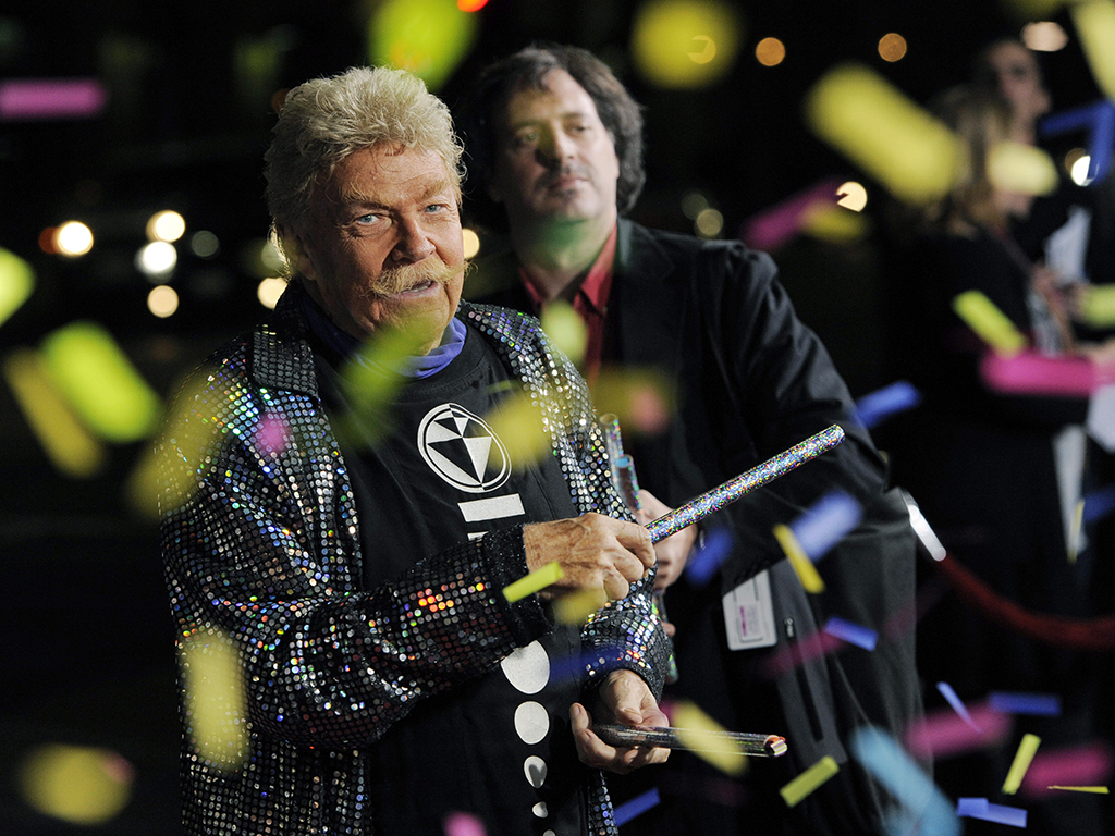 In this Wednesday, Oct. 13, 2010, file photo, comedian Rip Taylor throws confetti on photographers at the premiere of the film ‘Jackass 3D,’ in Los Angeles. Taylor, the mustached comedian with a fondness for confetti-throwing who became a television game show mainstay in the 1970s, died Sunday, Oct. 6, 2019. He was 88.