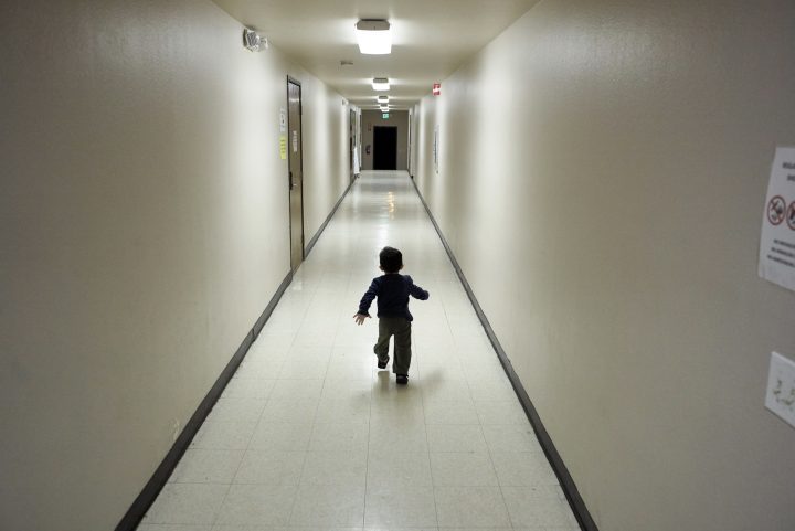 In this Dec. 11, 2018 file photo, an asylum-seeking boy from Central America runs down a hallway after arriving from an immigration detention center to a shelter in San Diego. 