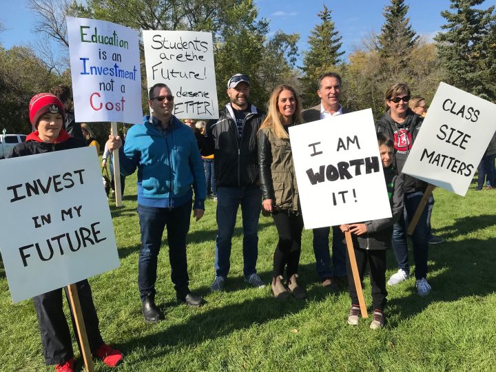 Signs held at the World Teachers Day celebrations did not hold back when it came to concerns around the education industry and its funding.
