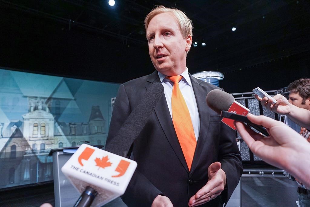Education Minister Dominic Cardy speaks to media after the New Brunswick leaders' debate in Moncton on Tuesday, Sept. 9, 2014.