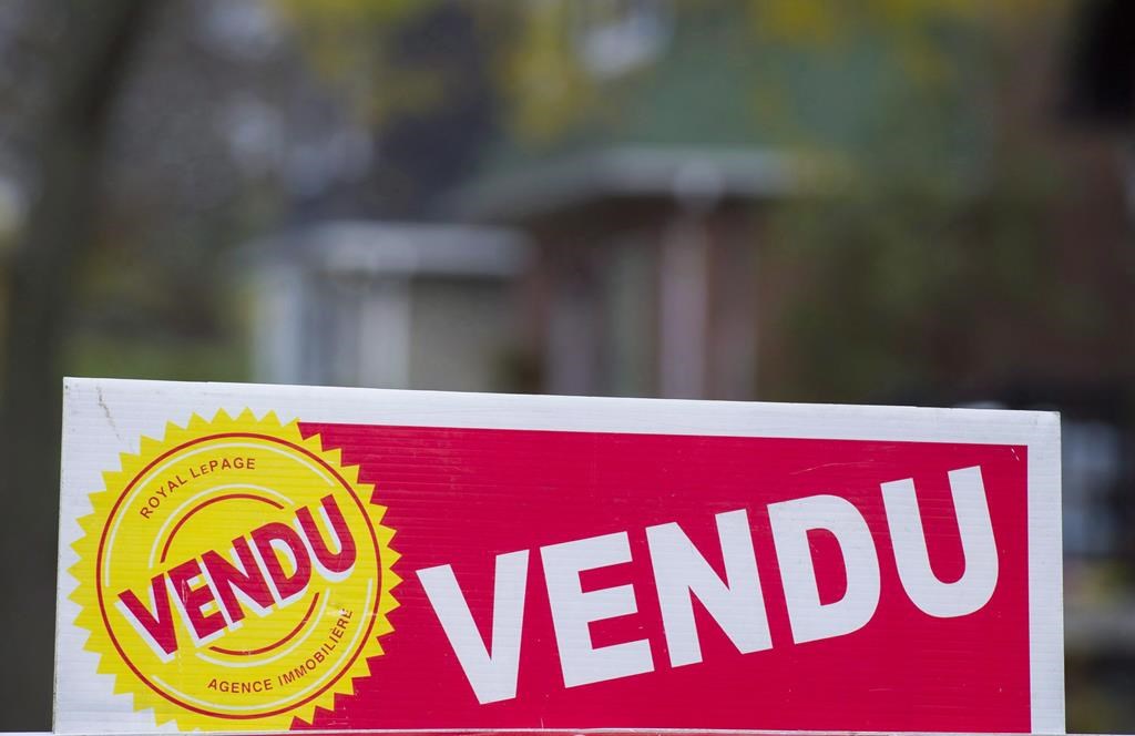 A sign meaning sold is shown on the west island of Montreal on November 4, 2017.
