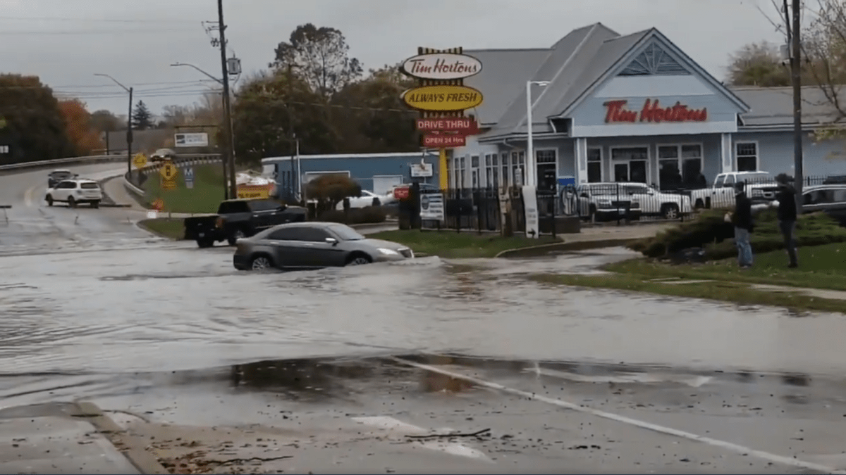 OPP say several cars drove past road closure signs in Port Dover after  parts of the community were hit with flooding.