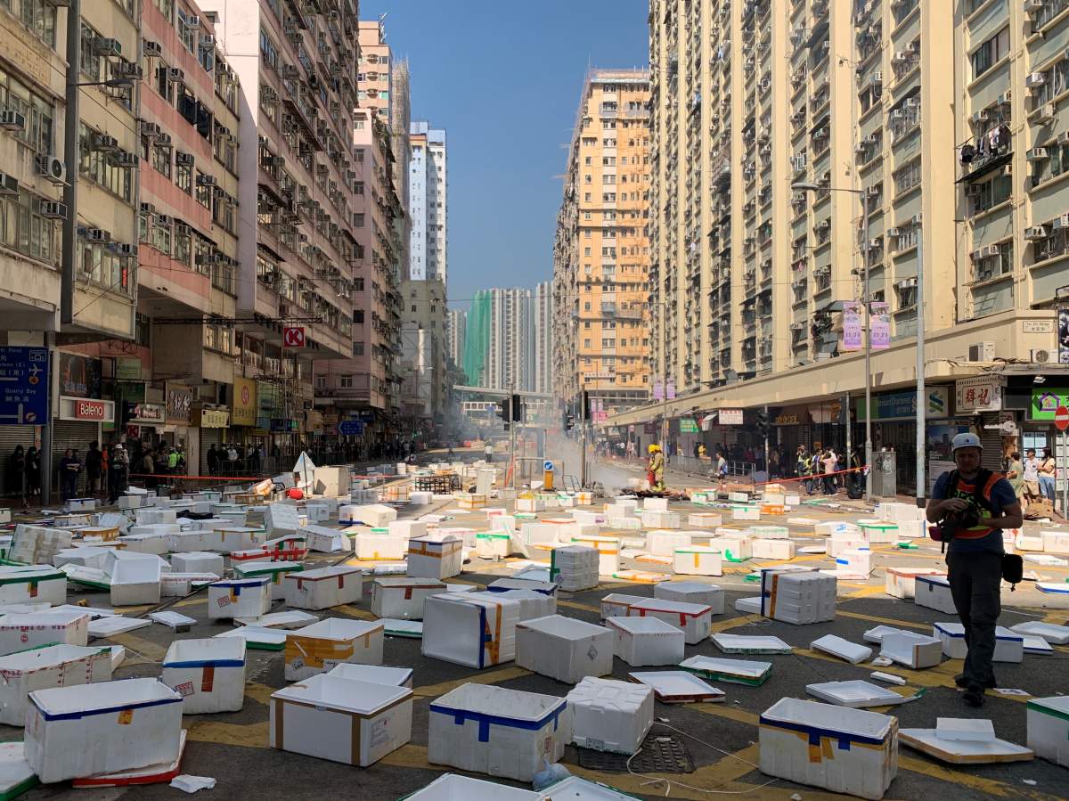 Protesters building barricades from white boxes in Sai Wan Ho area where a boy was allegedly shot and left unconscious this morning in Hong Kong, China November 11, 2019.