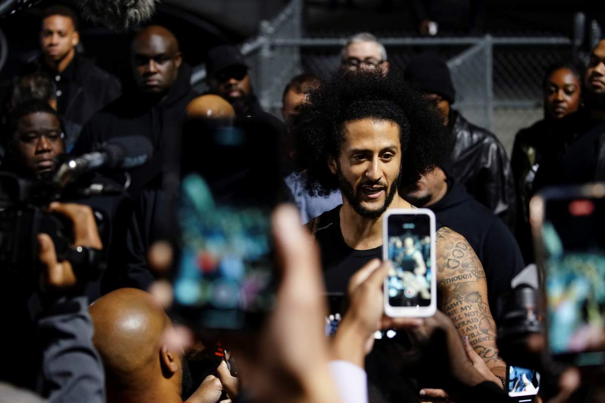 Colin Kaepernick speaks to the media following a special training event created by Kaepernick to provide greater access to scouts, the media, and the public, at Charles. R. Drew High School in Riverdale, Georgia, U.S., November 16, 2019.