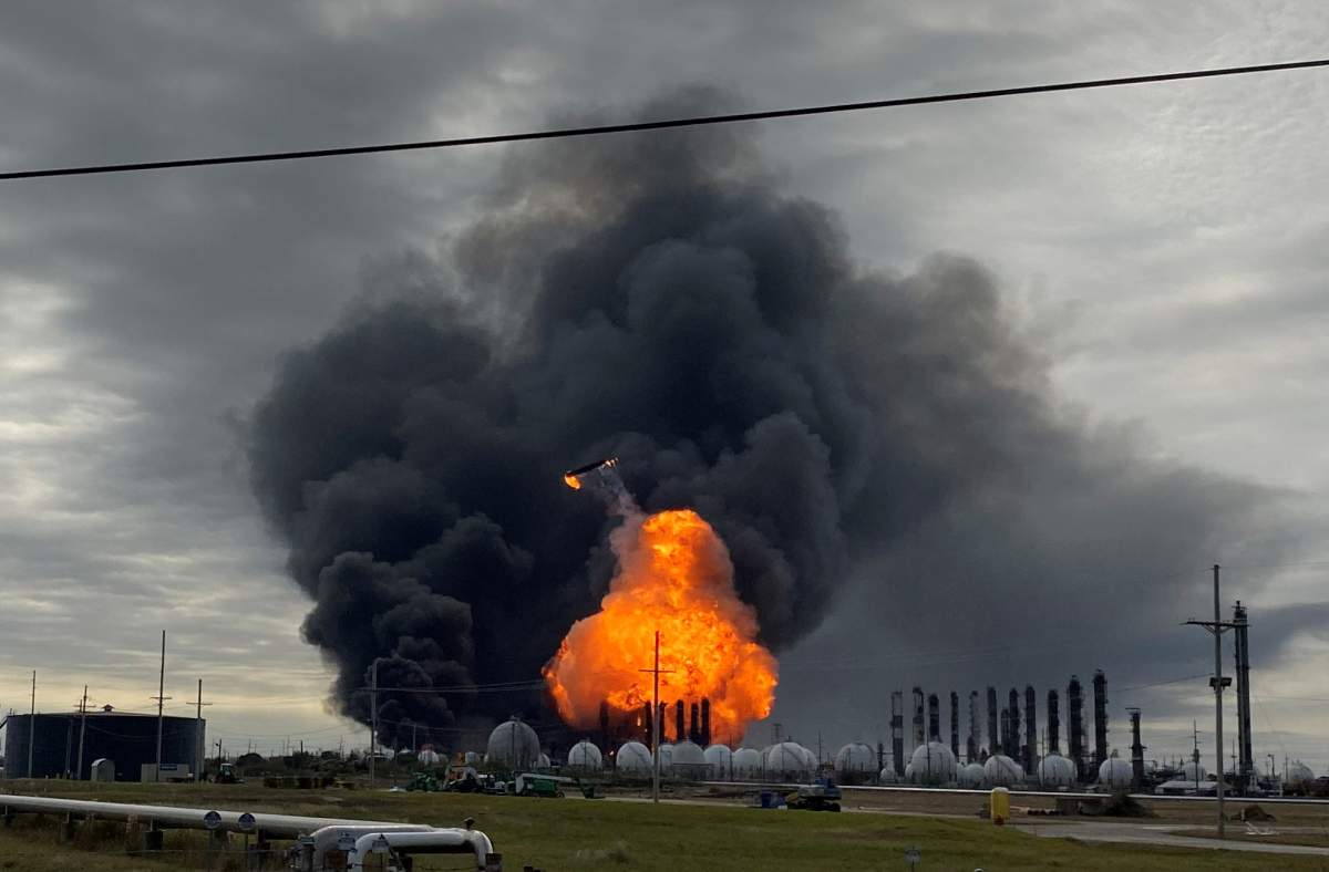 Flames are seen after a massive explosion that sparked a blaze at a Texas petrochemical plant in Port Neches, Texas, November 27, 2019.  REUTERS/Erwin Seba
