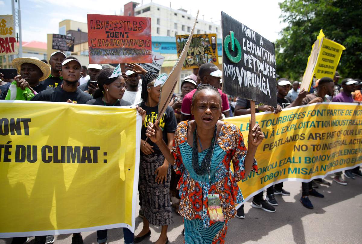 A woman leads environmental activists as they participate in the climate protest in the streets of Kinshasa, Democratic Republic of the Congo November 29, 2019. REUTERS/Hereward Holland