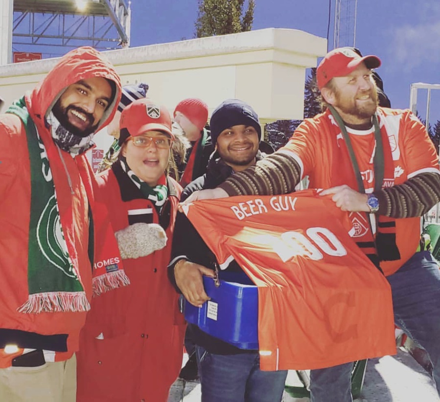 Members of the Foot Soldiers present the personalized jersey.