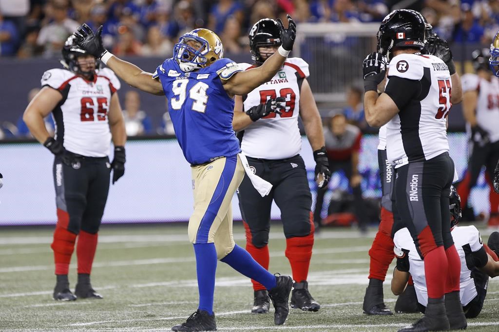 The Winnipeg Blue Bombers' Jackson Jeffcoat (94) celebrates sacking Ottawa Redblacks quarterback William Arndt (8) during the second half of CFL action in Winnipeg, Friday, July 19, 2019.