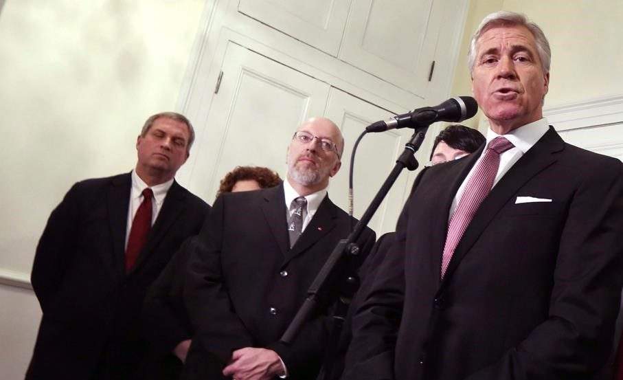 Liberal MLA Perry Trimper is seen (middle) with former N.L. Liberal Party Leader Dwight Ball, joined by Gerry Byrne, as he speaks with the media on Monday, Dec. 14, 2015.