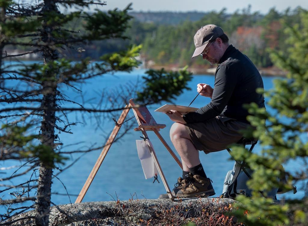 Artist Geoffrey Grantham paints overlooking Susies Lake in the Blue Mountain-Birch Cove Lakes Wilderness Area, one of the largest urban parks in the country, in Halifax on Tuesday, Oct. 29, 2019.