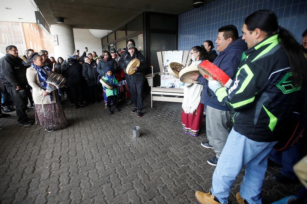 People drum at a vigil for Hunter Haze Straight-Smith, the three-year-old who was allegedly stabbed by his mother’s boyfriend and taken off life support today, outside Winnipeg’s Childrens Hospital, Friday, November 1, 2019. THE CANADIAN PRESS/John Woods