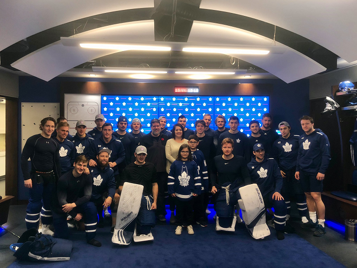Kade Foster and his family are pictured with the Leafs on Saturday.