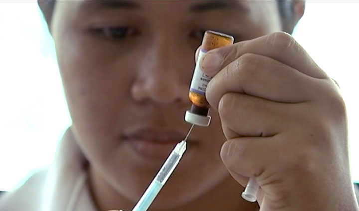 A New Zealand health official prepares a measles vaccination at a clinic, Monday, Nov. 25, 2019, in Apia, Samoa.