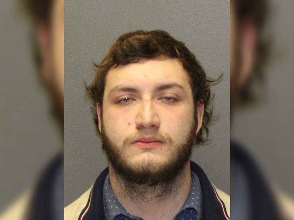 A bank teller was arrested in connection to a home invasion involving a bank's customer on Nov. 11.