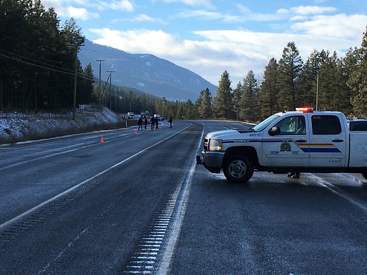 A police vehicle can be seen blocking traffic along Highway 97 near Westwold on Tuesday.