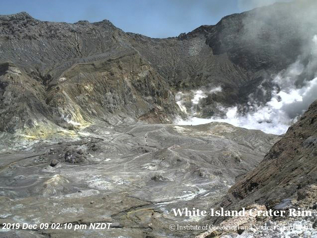 An aerial view shows hikers walking on the crater rim of Whakaari, also known as White Island, shortly before the volcano erupted in New Zealand, on Dec. 9, 2019, in this image obtained via social media.