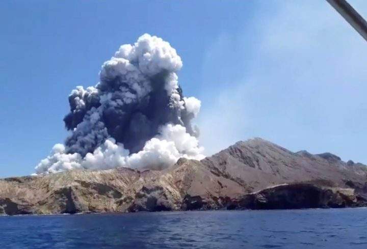 Smoke from the volcanic eruption of Whakaari, also known as White Island, is pictured from a boat in New Zealand on Dec. 9, 2019 in this screen grab obtained from a social media video.