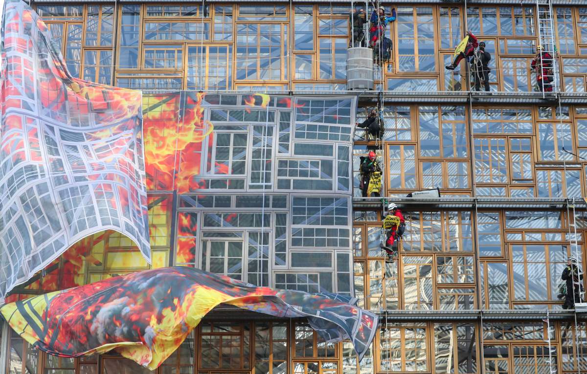 Police remove climate change activists from the EU Council headquarters, during a Greenpeace protest, ahead of an EU leaders summit in Brussels, Belgium December 12, 2019.