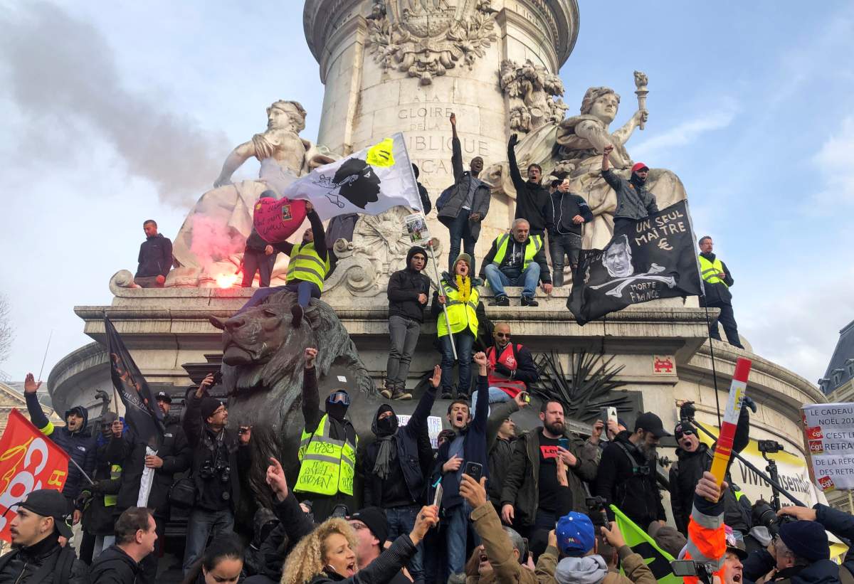 French labour union members and workers on strike attend a demonstration in Paris as France faces its 13th day of consecutive strikes against French government's pensions reform plans, December 17, 2019.  