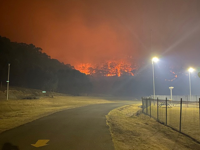 A bushfire burns near the Lithgow Correctional Centre compound in Marrangaroo, New South Wales, Australia on Dec. 19, 2019 in this picture obtained from social media.