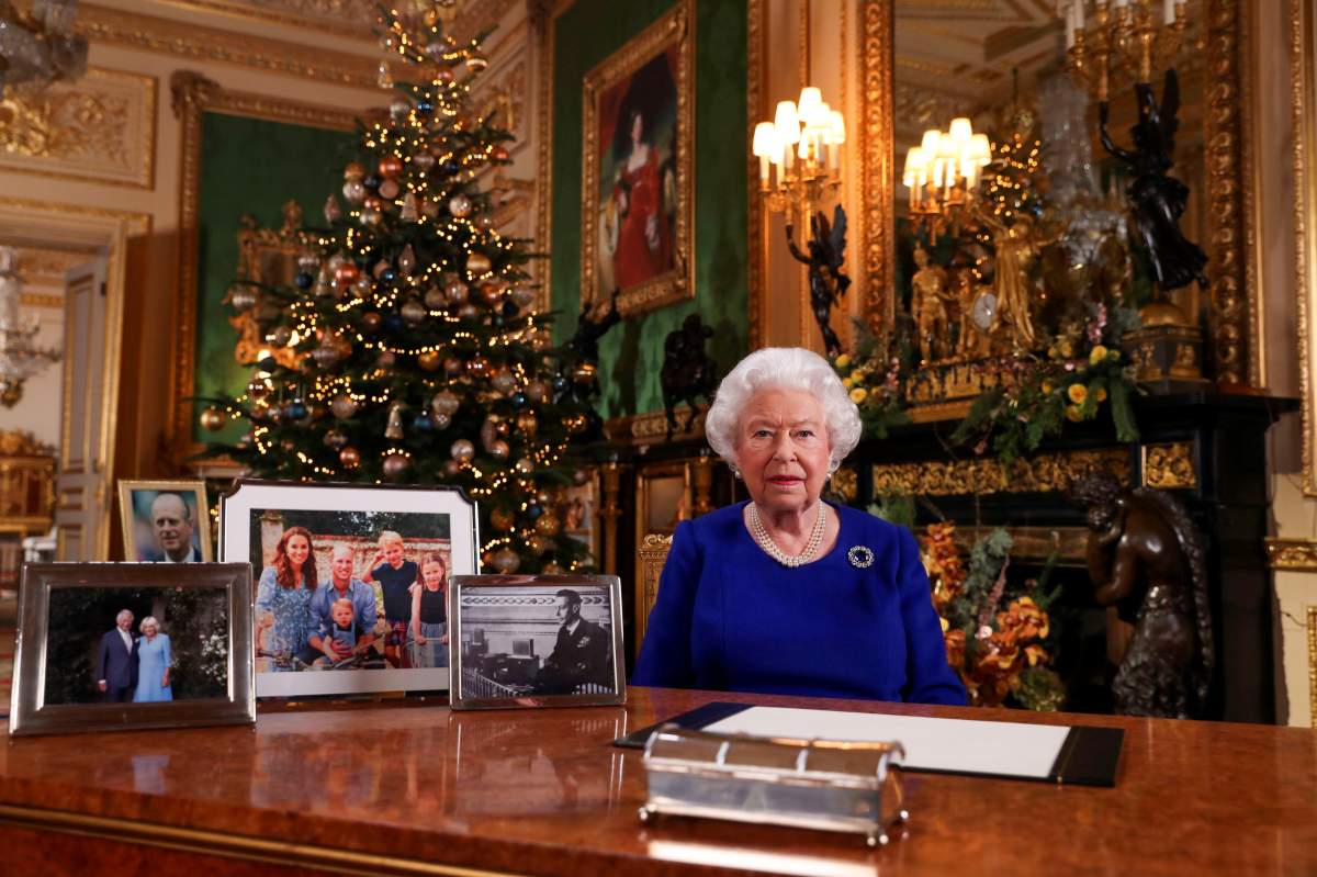 Britain’s Queen Elizabeth poses, after recording her annual Christmas Day message in Windsor Castle, in Berkshire, Britain, in this undated pool picture released on December 24, 2019.