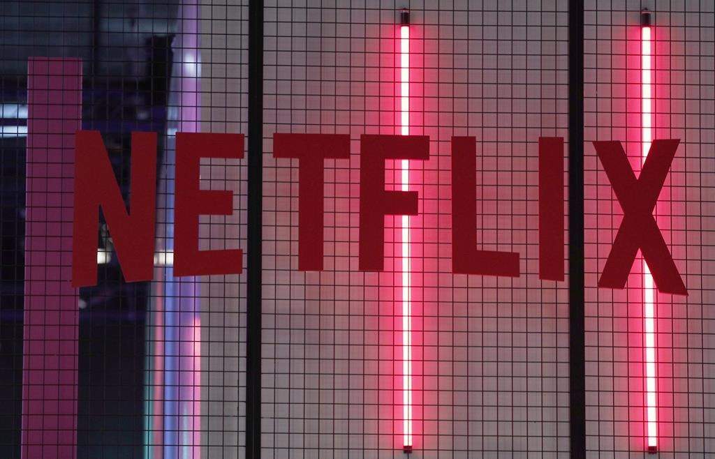 The logo of American entertainment company Netflix is pictured at the Paris games week in Paris, Saturday, Nov. 4, 2017. THE CANADIAN PRESS/AP-Christophe Ena