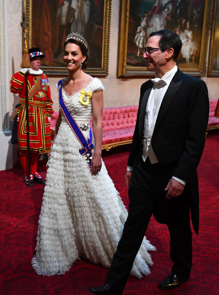 Catherine, Duchess of Cambridge and United States Secretary of the Treasury Steven Mnuchin arrive through the East Gallery for a state banquet at Buckingham Palace on June 3, 2019. Photo: Getty Images