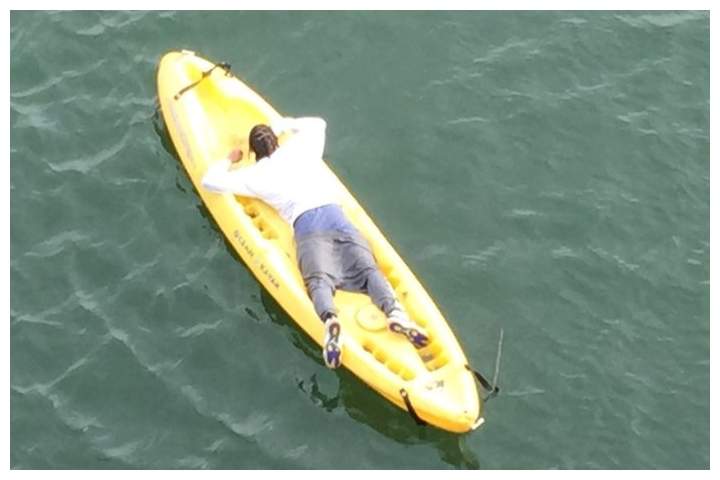 A suspect is shown on a kayak on the Colombia River in Portland, Ore., on Dec. 18, 2019.