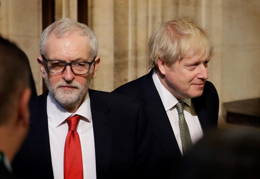 Britain’s Prime Minister Boris Johnson, right, and opposition Labour Party Leader Jeremy Corbyn, left, walk through the Commons Members Lobby after hearing the Queen’s speech in Parliament, in London, England, on Thursday, Dec. 19, 2019.